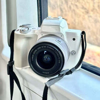 Campus Sport Digital Camera on a window sill, showcasing its portable design and modern features for students and creators.